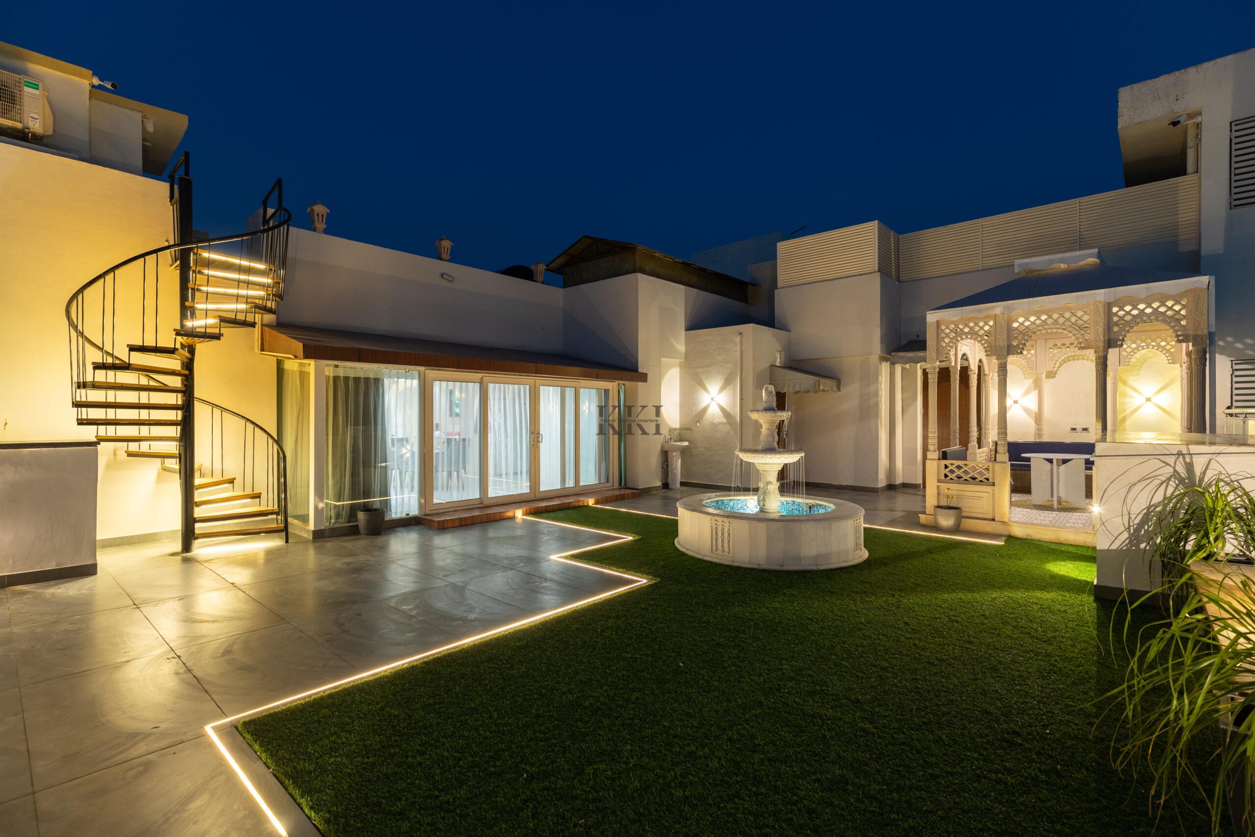 Home Garden deck area with pergola, fountain and open garden area